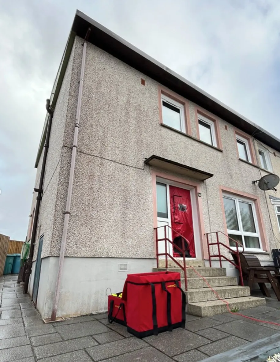 Retrotec blower door equipment set up for airtightness testing in a doorway