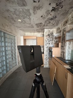 Matterport Pro 3 camera documenting a kitchen with extensive mould caused by firefighting water, captured as part of an insurance reinstatement record