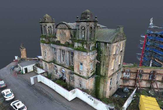 Colourised drone LiDAR point cloud of the former Victoria Infirmary building in Battlefield, Glasgow, showing its twin domed towers and weathered sandstone façades